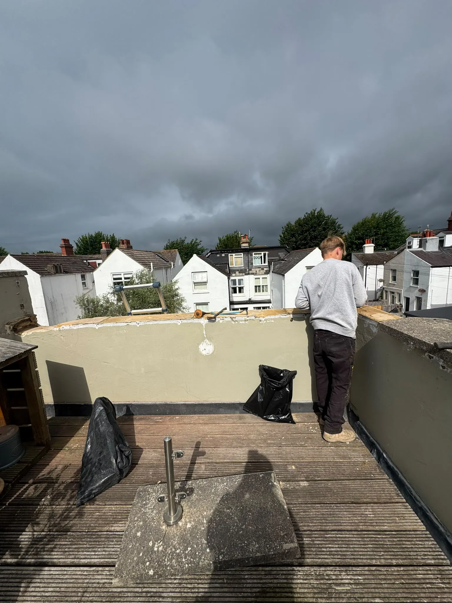 Balcony wall in Brighton with the old coping stones removed and the wall top cleared ready for a new capping
