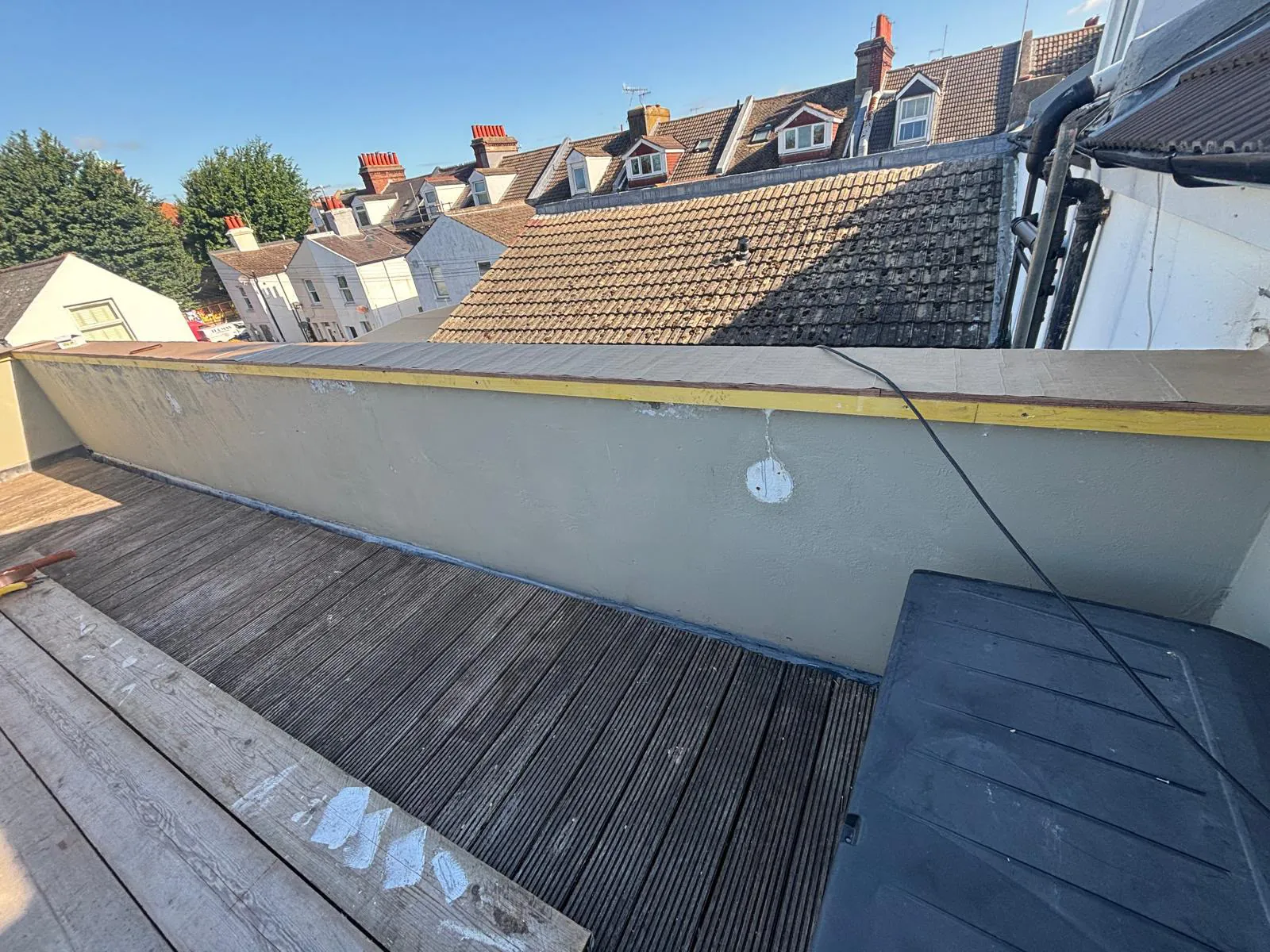 Marine ply base fixed along the full length of the balcony parapet wall