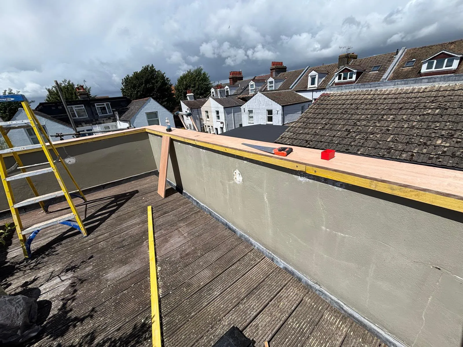 Marine ply base fitted around the corner of the balcony wall ready for leadwork