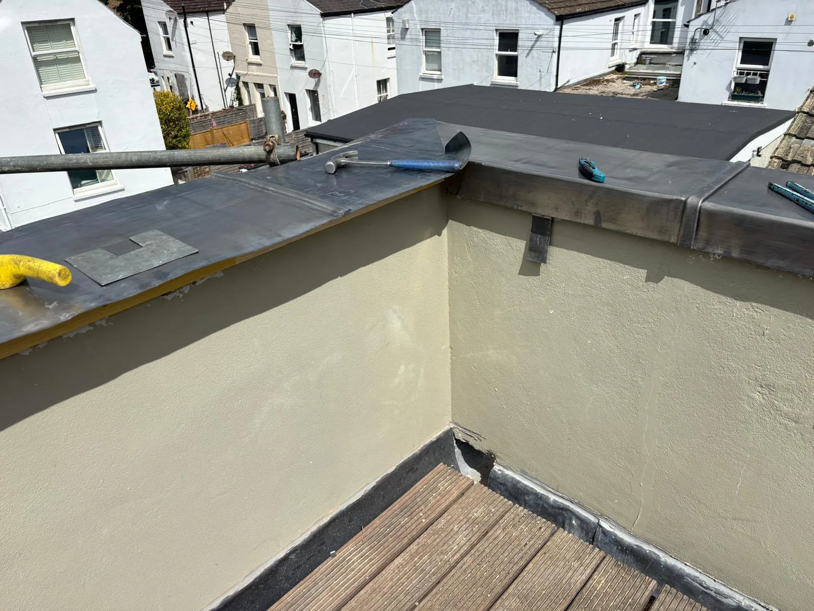 Welded lead corner joint on the balcony wall capping — seamless watertight corner
