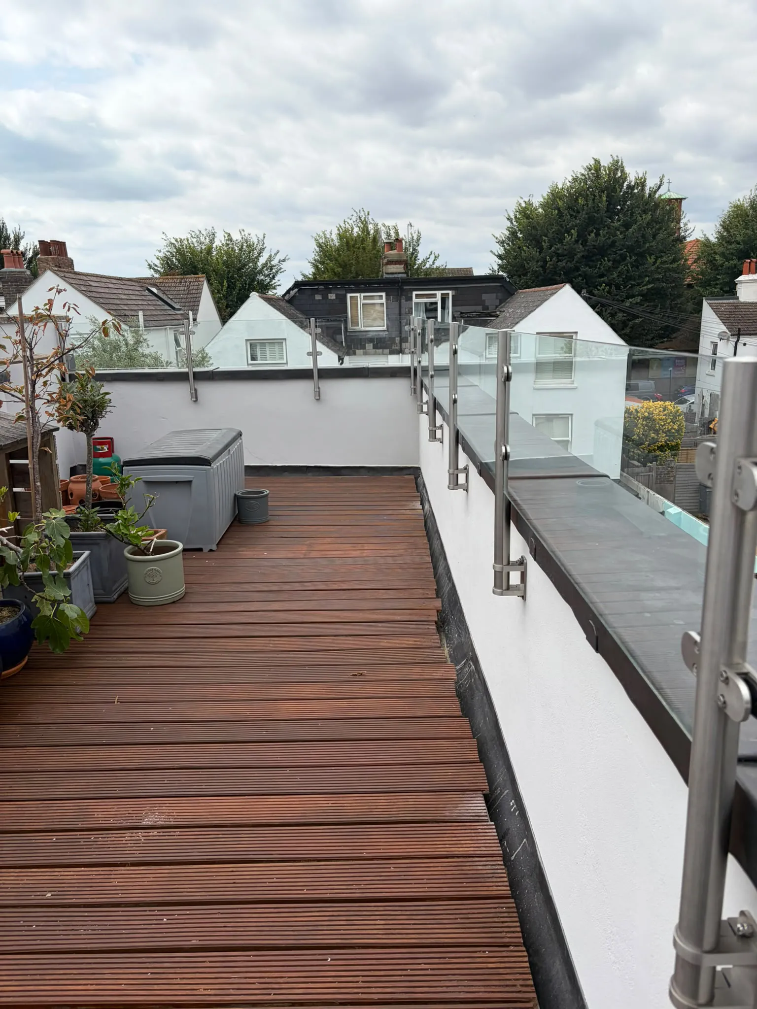 Completed balcony in Brighton with Code 5 lead wall capping and the glass balustrade reinstalled