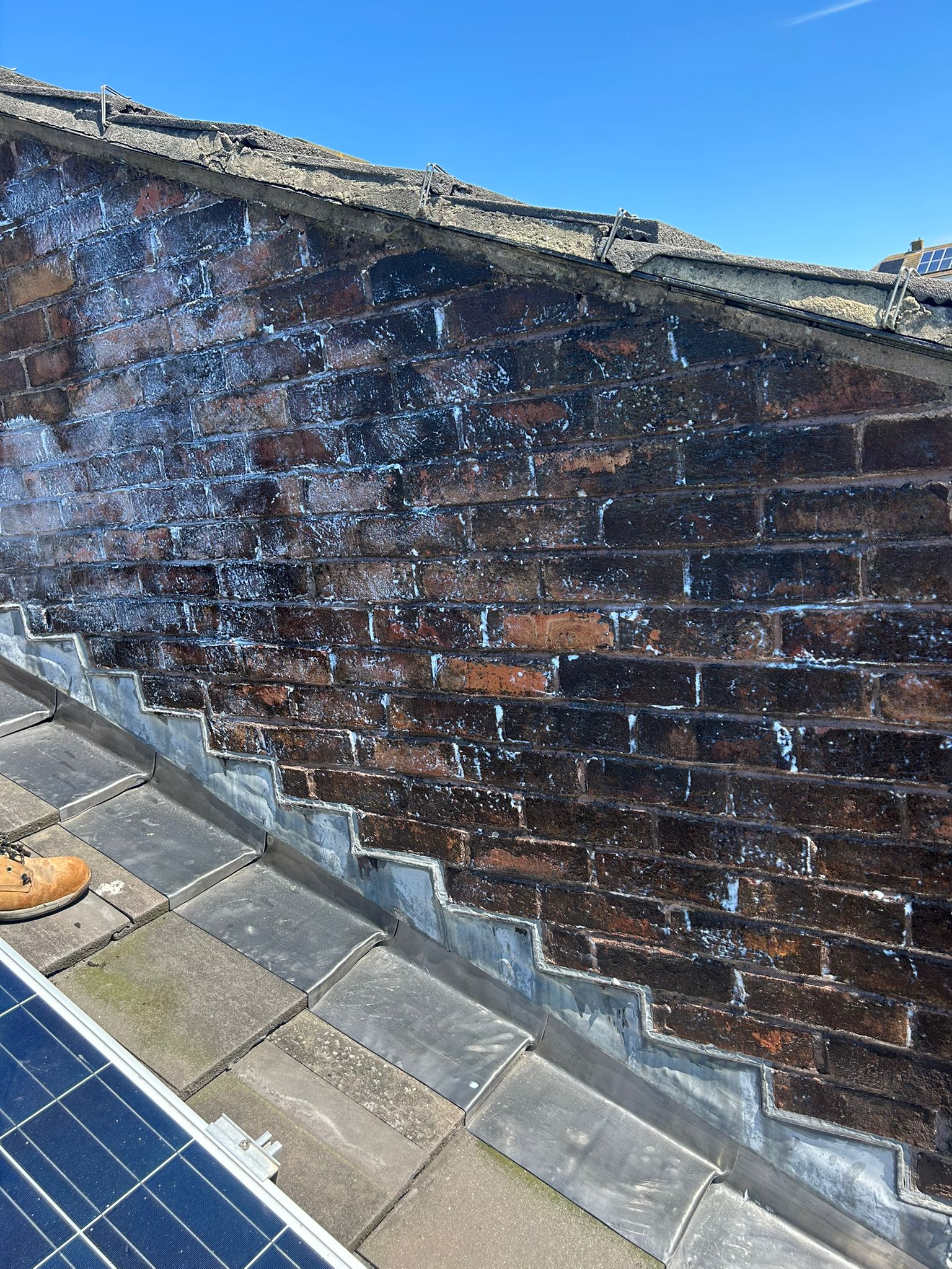Adjoining brick wall after Stormdry application in Whitehawk, Brighton — full face treated and sealed against driving rain while remaining breathable