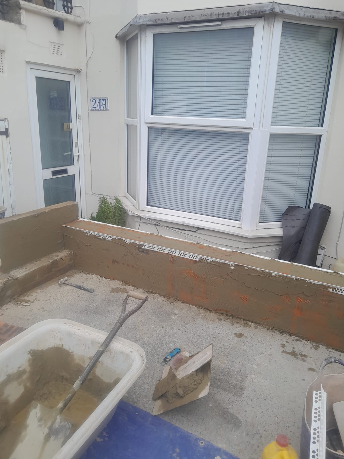 Wall rebuild in progress — new brickwork ready for render, Old Shoreham Road, Brighton